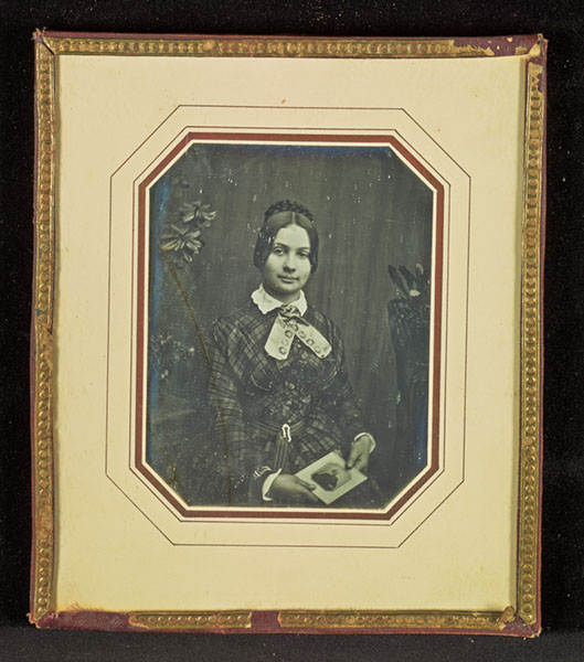 [Portrait of a Woman Holding a Daguerreotype Portrait of a Man]